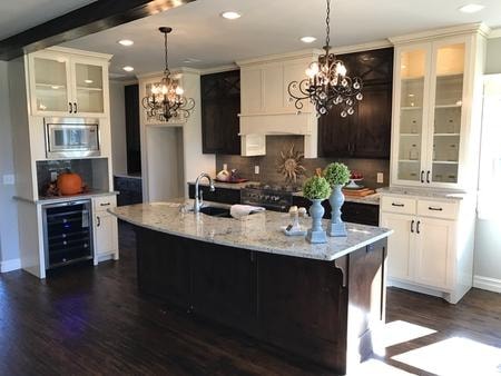 Finished panoramic kitchen with gray island and custom cabinetry